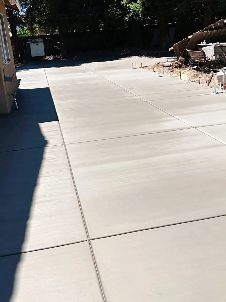 Fresh broom-finish concrete patio and driveway