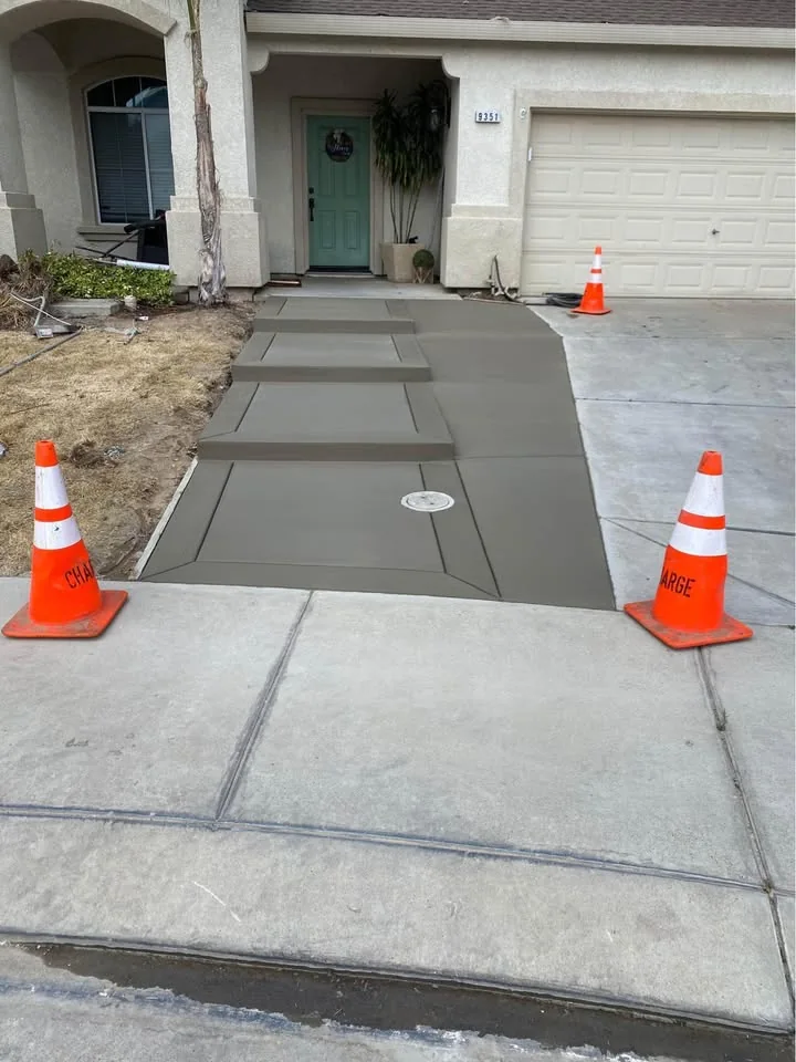 New concrete driveway approach with clean panel borders